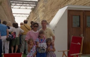 MilKid - Sarah and her family on a ship going through the Corinth Canal in Greece